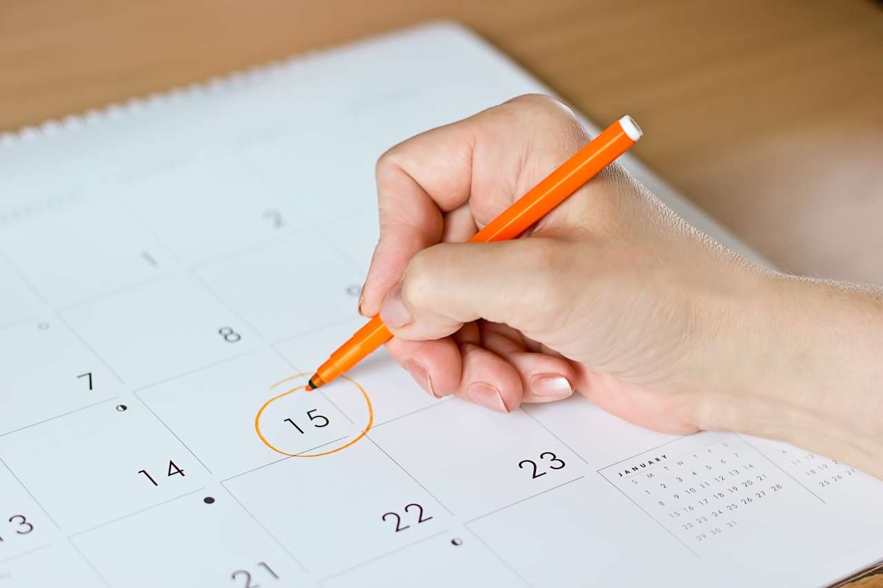 Wlman marking her calendar